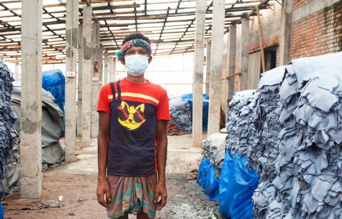 Worker with protective mask in a leather factory in Bangladesh