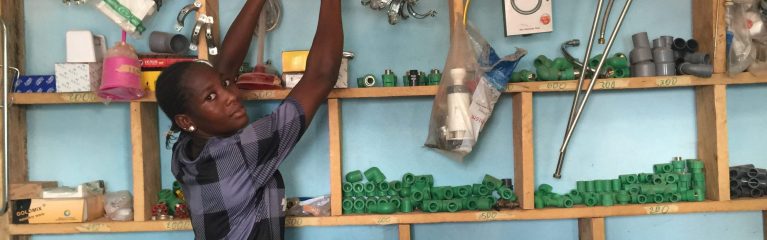 Young woman sorting goods